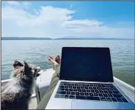  ?? (Special to the Demorat-Gazette/Eli Cranor) ?? The author … perched on the bow of his pontoon boat, staring out over Lake Dardanelle, Jimmy Buffett on his mind.