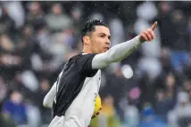  ??  ?? MARCO BERTORELLO/AFP Juventus forward Cristiano Ronaldo celebrates after scoring a penalty in his side’s Serie A match against Sassuolo in Turin, Italy, on December 1, 2019.