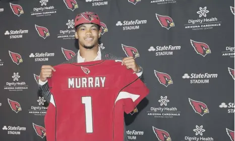  ?? PICTURE: GETTY ?? 0 Kyler Murray shows off his new Arizona Cardinals shirt after a move that was the worst-kept secret in football.