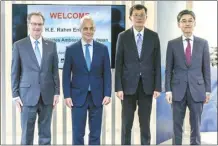  ?? U.S. Embassy photo via AP ?? U.S. Ambassador to Japan, Rahm Emanuel (center left), poses with the officials of Mitsubishi Heavy Industries (MHI) and Lockheed, during his visit to a MHI’s F-35 fighter jet final assembly and inspection plant in the town of Toyoyama in the Aichi prefecture, western Japan on Tuesday.