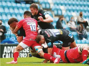  ??  ?? Battering ram: Dave Ewers powers over for Exeter’s first try