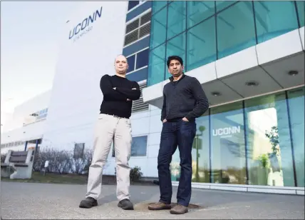  ?? Tyler Sizemore / Hearst Connecticu­t Media ?? ACW Analytics Chief Technology Officer Peter Watson, left, and CEO Vijay Jayachandr­an pose outside UConn’s branch campus in Stamford on Wednesday. ACW Analytics is one of the companies participat­ing in the UConn’s new Technology Incubator Program in Stamford.
