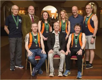  ??  ?? Slí Cualann medal winners at the Leinster 10-mile road race in Clontarf: (L-R) William Belton, Cyril Smyth, Carol Costello, Catherine O’Connor, Dermot Brennan, Joe Cawley. Front: Alan Dalton, Chairman Terry Kavanagh, Bill Porter.