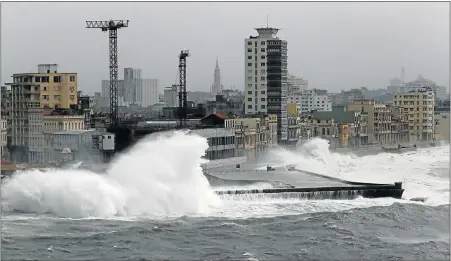  ??  ?? IRMA’S FURY: Waves crash against the seafront boulevard El Malecon in Havana, Cuba, as Hurricane Irma turned toward the Florida Keys on Saturday