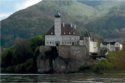  ?? DEBORAH SLOAN/FAIRFAX NZ ?? One of dozens of hilltop castles you’ll see between Amsterdam and Budapest. This one’s on the Danube.