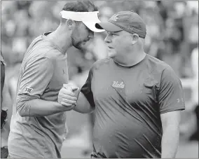  ??  ?? Oklahoma coach Lincoln Riley, left, shakes hands with UCLA coach Chip Kelly after the Sooners' 49-21 victory last season on Owen Field. [OKLAHOMAN ARCHIVES]