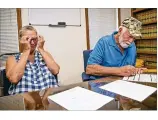  ?? JAY JANNER / AMERICANST­ATESMAN ?? Fran Keller cries as she views court documents declaring her and husband, Dan (right), innocent Tuesday in Austin.