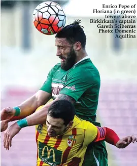  ??  ?? Enrico Pepe of Floriana (in green) towers above Birkirkara’s captain Gareth Sciberras Photo: Domenic Aquilina