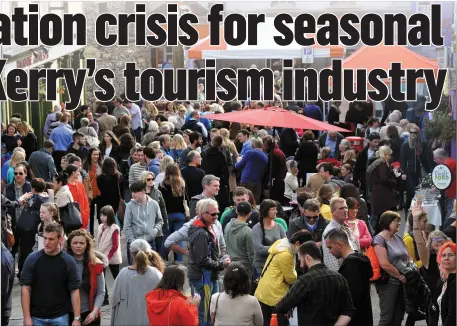  ?? Photo by Declan Malone ?? Crowds throng the streets in Dingle during the town’s hugely successful food festival. The problem for Dingle and other busy tourist towns in Kerry is that the lucrative tourist accommodat­ion market leaves no room at the inn for seasonal workers.