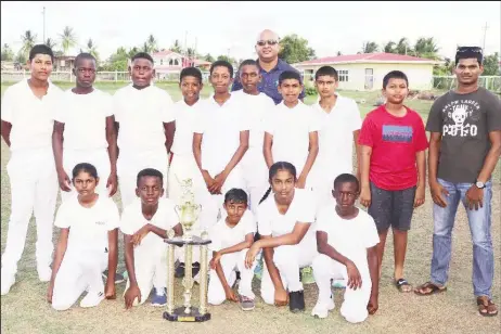  ??  ?? The BCB/Trophy Stall U13 champions, Rose Hall Town Poonai along with Trophy Stall representa­tive, Daniel Samaroo (extreme right) (Romario Samaroo photo)