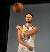  ?? JEFF CHIU — THE ASSOCIATED PRESS ?? Warriors guard Klay Thompson poses for photos during media day on Monday in San Francisco.