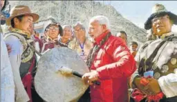  ?? PTI PHOTO ?? ▪ Prime Minister Narendra Modi beats a drum at Muktinath Temple in Nepal before leaving for India on Saturday. Speaking at a civic reception held in Kathmandu to honour him, Modi said India will stand shoulderto­shoulder with Nepal in its...