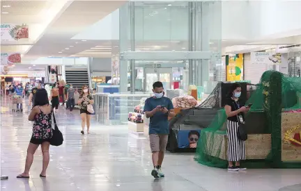  ?? PHILIPPINE STAR/MICHAEL VARCAS ?? A QUEZON CITY MALL on the second day of the implementa­tion of the Modified Enhanced Community Quarantine in the National Capital Region in May 2020.