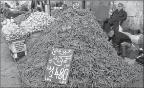  ??  ?? Bright green fava beans are for sale inside the medina, a walled old part of an Arab city, in Sfax, Tunisia.