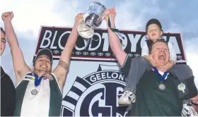  ??  ?? Captain Sam Talarico and coach Ken Hinkley with the 2003 premiershi­p cup.