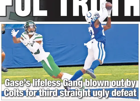  ?? Getty Images ?? THAT’S MINE! Xavier Rhodes intercepts a pass intended for Lawrence Cager during the second quarter of the Jets’ 36-7 loss to the Colts. Rhodes had two intercepti­ons on the day, one of which he returned for a touchdown.