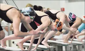  ?? Gregory Vasil / For Hearst Connecticu­t Media ?? Swimmers dive off the starting block during November’s FCIAC championsh­ip at Greenwich.