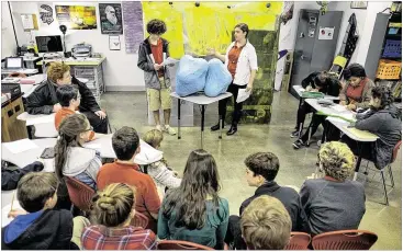  ?? RODOLFO GONZALEZ / AUSTIN AMERICAN-STATESMAN ?? Students Isaac Cutler (left) and Carson Raleigh discuss the parts of the plant cell with fellow ninth- grade students in Dr. Christina Bowers’ biology class last week at Meridian charter school. Founder Karalei Nunn said the school’s“big draw is the...