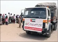  ?? Wam ?? Hodeida residents line up to receive aid supplies from the uae on Wednesday. —