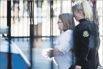  ?? CP PHOTO ?? Elizabeth Wettlaufer enters the Provincial courthouse in Woodstock, Ont., Thursday.