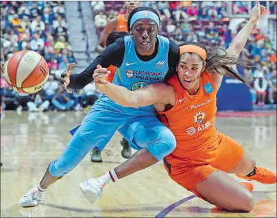  ?? SEAN D. ELLIOT/THE DAY ?? In this Sept. 6, 2019, file photo, Connecticu­t Sun center Brionna Jones, right, fouls Chicago Sky guard Kahleah Copper going after a loose ball in a WNBA game at Mohegan Sun Arena.