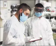  ?? Tyler Sizemore / Hearst Connecticu­t Media ?? Medical laboratory personnel ran coronaviru­s tests in Stamford Hospital, in a May file photo.