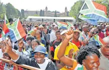  ?? ?? THE SOUTH African flag flies high as thousands gather at the Union Buildings for Freedom Day celebratio­ns in this file photo. I GCIS