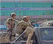  ?? (AFP) ?? Afghan security forces at the site of the attack, outside the Iraqi Embassy, in Kabul on Monday