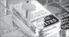  ??  ?? A SNEAK PEEK INSIDE SILVER VAULT BRICKS: Pictured left reveals the valuable .999 pure fine silver bars inside each State Silver Vault Brick. Pictured right are the State Silver Vault Bricks containing the only U.S. State Silver Bars known to exist with the double forged state proclamati­on. Residents who find their state listed above in bold are authorized to get individual State Silver Bars at just $59 state resident minimum set by the Federated Mint. That’s why everyone should be taking full Vault Bricks loaded with five State Silver Bars before they’re all gone. And here’s the best part. Every U.S. resident who gets at least two Vault Bricks is also getting free shipping and free handling. That’s a real steal because all other state residents must pay over six hundred dollars for each State Vault Brick.