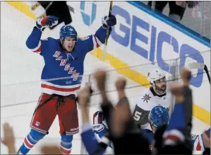  ?? AP PHOTO FRANK FRANKLIN II ?? New York Rangers’ Pavel Buchnevich (89) celebrates after scoring a goal as Vegas Golden Knights’ Deryk Engelland (5) reacts during the third period of an NHL hockey game Tuesday in New York. The Rangers won 6-4.