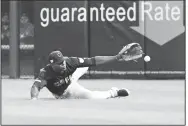  ?? AP/DAVID BANKS ?? Cleveland Indians right fielder Yasiel Puig can’t catch an RBI triple by Chicago White Sox’s Jose Abreu during the fifth inning of a baseball game Thursday in Chicago.