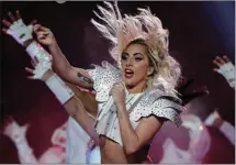  ?? The Associated Press ?? Lady Gaga performs during the halftime show of the NFL Super Bowl in February. The singer has postponed her world tour’s European leg until next year because of ongoing health problems.