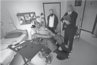  ?? MIKE DE SISTI/MILWAUKEE JOURNAL SENTINEL ?? Veteran and resident Kenney Blue talks with Assembly Speaker Robin Vos and Sen. Van Wanggaard in Blue’s room at Wisconsin Veterans Home, Boland Hall, in Union Grove in 2022. The facility has a high number of federal deficiencies when compared to other such state veterans nursing homes around the country.