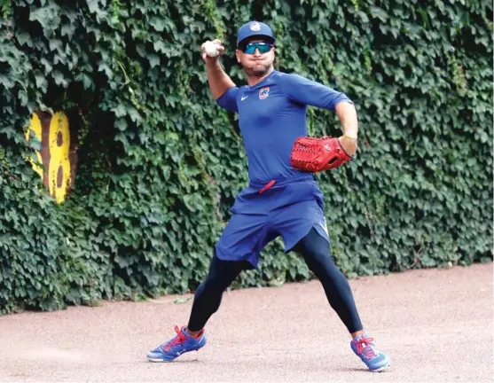  ?? AP ?? Albert Almora was shaken up after running into the wall in center field while trying to catch a fly ball Friday. “You’d like him to be a little more timid,” manager David Ross said.