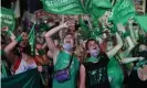  ?? Photograph: Natacha Pisarenko/AP ?? Activists watch streaming of Argentina’s MPs legalising abortion last year. The country became only the third in South America to allow elective abortions.