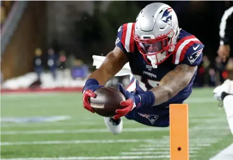  ?? NAncy lAnE / HErAld stAFF FIlE ?? ANOTHER LOOK: Patriots wide receiver N’Keal Harry appears to score a touchdown during the fourth quarter against the Chiefs on Dec. 8. He was later ruled out of bounds. Owners are expected to vote Thursday on adding a ‘sky judge’ or eighth official in the booth.