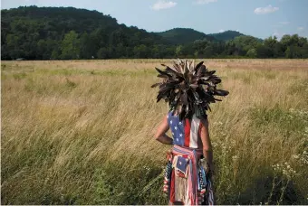  ??  ?? Shawn Reilly, a Native American veteran, outside the Monroe Independen­ce Day Powwow, Sardis, Ohio, 2015; photograph by Lauren Pond from the ‘Looking at Appalachia’ project, curated by Roger May