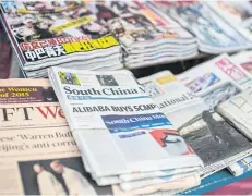  ?? AFP ?? A copy of the ‘South China Morning Post’ and other newspapers are seen at a newsstand in Hong Kong.