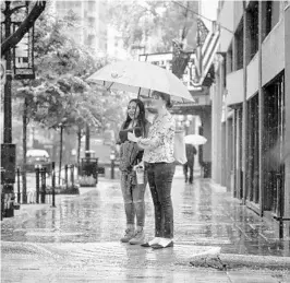  ?? JACOB LANGSTON/STAFF PHOTOGRAPH­ER ?? A deluge of rain throughout Central Florida during May brought out the umbrellas and set the stage for increased risks of mosquito-borne illnesses, including Zika and yellow fever.