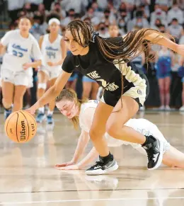  ?? STAFF ?? Cyriah Griffin, then with King’s Fork but now with Menchville, dribbles the ball away from Millbrook’s Avery O’Roke during the Class 4 state championsh­ip game at VCUs Siegel Center in March 2022. Griffin plans to play for VCU.