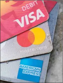  ??  ?? American Express, Visa and Master card cards on display in Richmond, Virginia, Thursday, July 1, 2021. (AP)