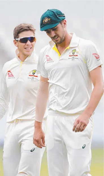  ?? Picture: AFP PHOTO ?? SUPPORTIVE: Australian captain Tim Paine chats with bowler Pat Cummins on the second day of the fourth Test against South Africa at The Wanderers in Johannesbu­rg.