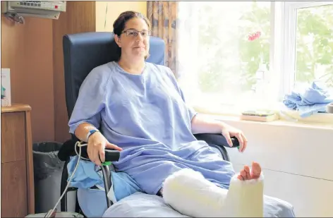  ?? RYAN ROSS/THE GUARDIAN ?? Rebecca MacNeill sits in her room at the Queen Elizabeth Hospital in Charlottet­own where she’s recovering from several injuries after a deck she was on collapsed on Aug. 8.