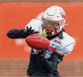  ?? Butch Dill/Associated Press ?? UH wide receiver Nathaniel “Tank” Dell has stood out in practices at the Senior Bowl and could be a late-round option in the draft for the Texans.