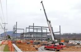  ?? STAFF FILE PHOTO BY C.B. SCHMELTER ?? The framing structure of a new medical arts building is seen near the Cameron Harbor area recently.