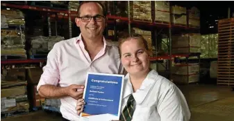  ?? Photo: Bev Lacey ?? GRADUATION: Member for Toowoomba South, David Janetzki, congratula­tes Centenary Heights High School student, Rachael Purdon, as she graduated from her Endeavour course yesterday.