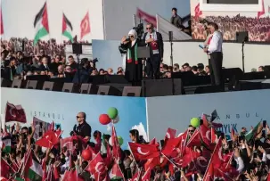  ?? (Burak Kara/Getty Images) ?? TURKEY’S PRESIDENT Recep Tayyip Erdogan and his wife, Emine Erdogan, greets supporters in Istanbul during a rally in October in solidarity with Palestinia­ns in Gaza.