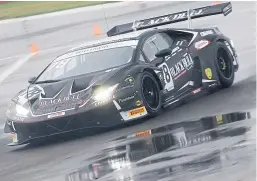  ?? Picture: McMedia. ?? Sandy Mitchell in the Lamborghin­i Huracan Evo GT3 at a wet Donington Park.