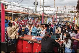  ?? DAN BALILTY / THE NEW YORK TIMES ?? Music fans show their “Green Pass” before entering a concert in Tel Aviv on March 26. Vaccine passports are also stirring complicate­d political and ethical debates about discrimina­tion, inequality, privacy and fraud.