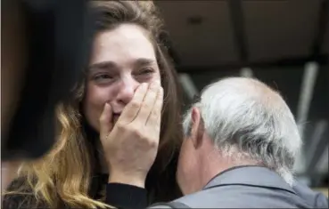  ?? MARK LENNIHAN — ASSOCIATED PRESS ?? Daily News reporter Chelsia Rose Marcius cries as she is hugged by staff photograph­er Todd Maisel after they were both laid off Monday.